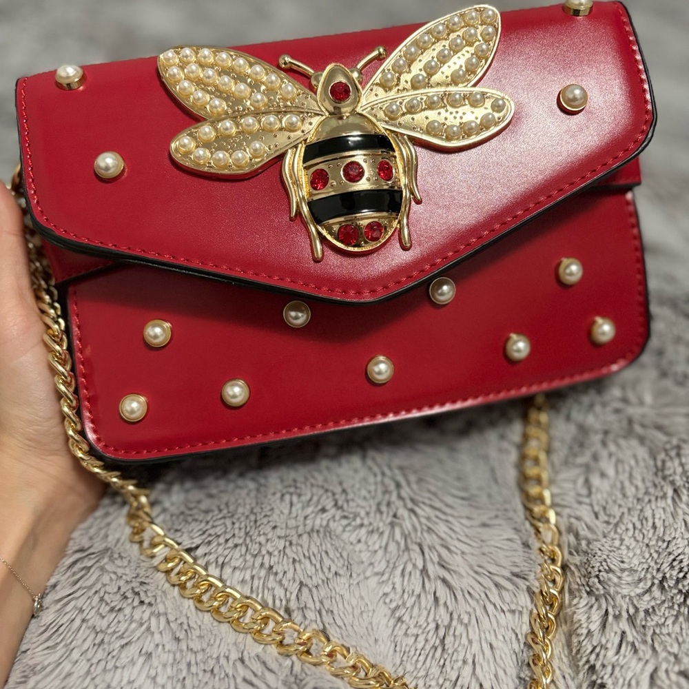 Elegant Red Handbag with Gold Bee Accent